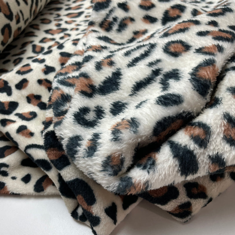 Fleece Stoff Leo Muster beige
