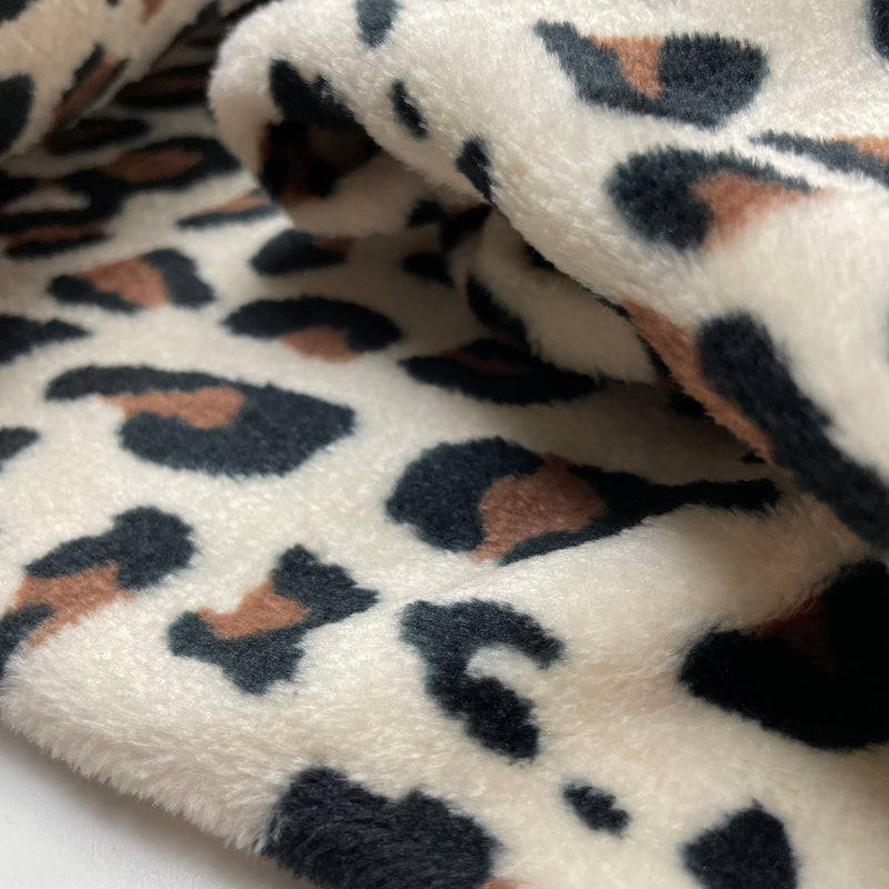 Fleece Stoff Leo Muster beige