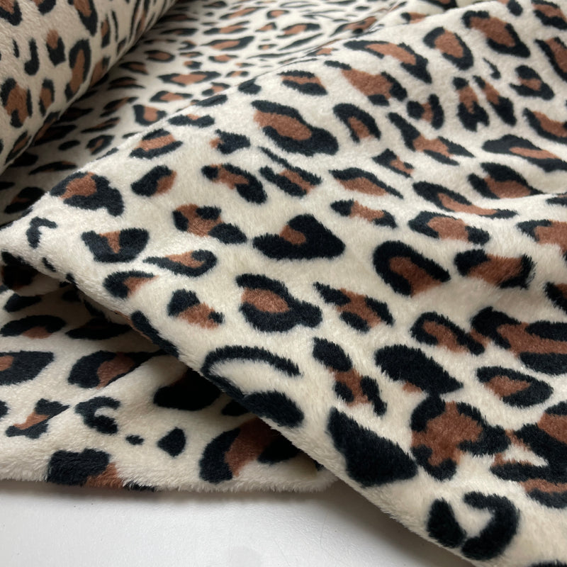 Fleece Stoff Leo Muster beige